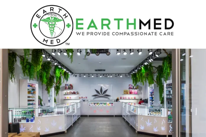 EarthMed McHenry dispensary interior with bright lights, green plants, glass display cases, and a leaf logo on the wall.