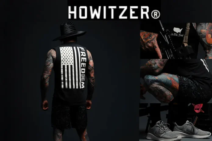 Model wearing Howitzer Clothing with patriotic “FREEDOM” tank top, showcasing bold tattoos and tactical-inspired streetwear.