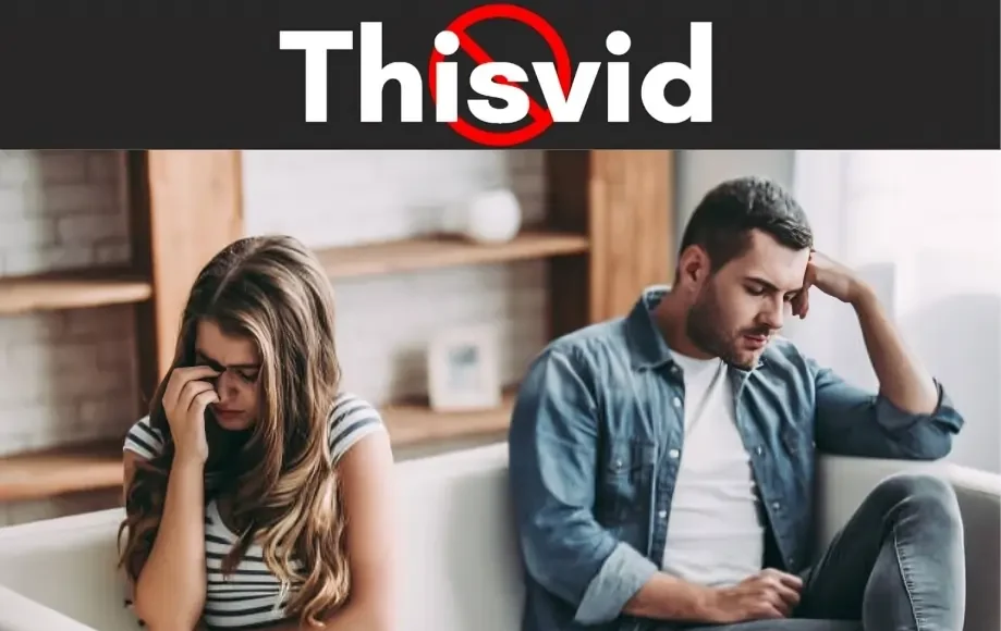 Thisvid logo above a sad couple sitting apart on a couch, both looking stressed and upset.