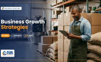 Business Growth Strategies: Proven Ways to Grow a Business Business growth strategies featured image showing a coffee roastery owner checking orders on a tablet in his expanding warehouse