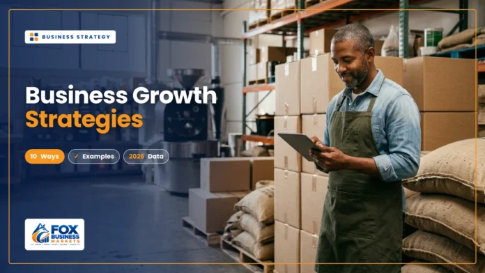 Business growth strategies featured image showing a coffee roastery owner checking orders on a tablet in his expanding warehouse