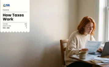 How Taxes Work: A Beginner’s Guide to U.S. Taxes Woman reviewing a tax form at her laptop to understand how taxes work