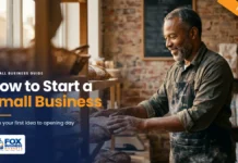 How to Start a Small Business: A Step-by-Step Guide How to start a small business featured image showing a smiling bakery owner placing fresh bread on shelves in his small shop