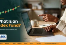 What Is an Index Funds? How It Works, Costs, and Returns in the US What is an index fund: woman pointing at a rising fund chart on her laptop at a kitchen table