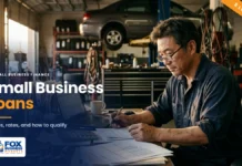 Small Business Loans: Types, Rates, and How to Qualify Small business loans featured image showing an auto repair shop owner reviewing loan paperwork at his desk