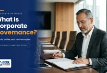 What Is Corporate Governance? How Companies Are Really Run Independent board chair reviewing a board meeting packet in a company boardroom, illustrating corporate governance